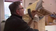 Detlef building model airplane.