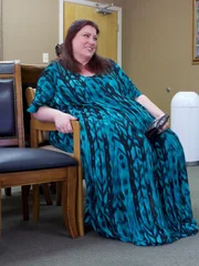 Erica sits in clinic waiting room
