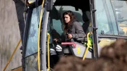 Emily Gorham in an excavator.