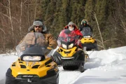 Todd, Jack and Hunter Hoffman on Skidoos.