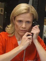 Angela in jail talking to Mike on visiting day.