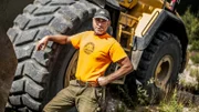 Chris Doumitt standing by a dozer.