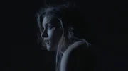 Woman looks frightened.
