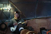 Zeke playing a guitar inside The Clark.