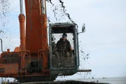 Cool shot of Hank Schimschat digging up a muddy mess.