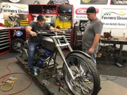 Brendon anxiously awaits Paul Teutul, Jr.’s approval of his handle bar design.