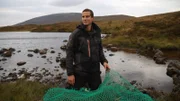 Bear holding net.