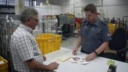 A border officer checks the medication.