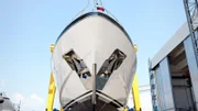 Front view of a large luxury motor yacht from a shipyard