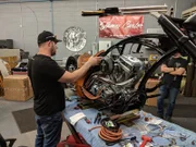 Paul Teutul Jr., installs the leather seat onto the Clay Walker bike.
