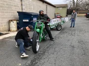 Mechanic Mike gets ready for a test ride on the NDFU bike with the new trailer.
