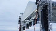 Stage spotlight with loudspeakers