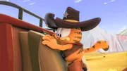 Garfield hält sich an der Kutsche fest.