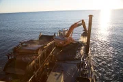 The AU Grabber digging in the ocean.
