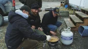 Steve Pomrenke and Jason Higa making dinner.
