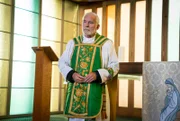 Father Timothy (Ian McElhinney).