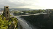 The Clifton Suspension Bridge, a classic landmark, spans the Avon Gorge to link Bristol, England, to the neighboring North Somerset.
