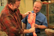 PROVO, UT, USA: Paleontologists Dr. Mathew Wedel and Dr. Phillip Lars Manning hold up the leg bone of a cow, demonstrating the differences between the bone of a mammal and that of a dinosaur.