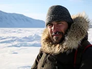 Hazen Audel stands at the edge of the frozen sea in Kangiqsujuac. The Inuit hunters of Nunavik in Canada have survived the frozen wilderness for centuries despite competition with wolves and polar bears. In spring, they take advantage of huge seasonal tides to venture under the sea ice in search of vital food gathered from the ocean floor.