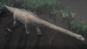 CGI: A mother and baby Titanosaur walk through the forest. Adult Titanosaurs were some of the heaviest creatures of all time, likely weighing over 100 tons.