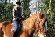 Worcester, Worcestershire, England - Presenter Dr Suzannah Lipscomb riding a horse.