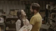 A couple gazes lovingly at one another.