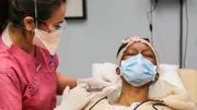 Dr. Lee injects Keke with some anesthesia.
