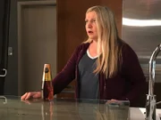 Dana finding a wine cooler in the fridge after being gone for a week.