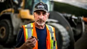 Chris Doumitt holding a cigar.