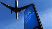 Jamaica, NY, USA: A plane flying over JFK International Airport.