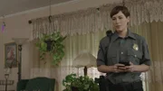 An officer takes notes.