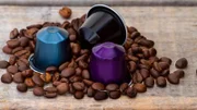 Italian coffee capsules or coffee pods on wood background