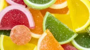 Rainbow jellos in glasses and plate on table, great party idea for kids, especially in summer.