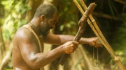 Omar cutting something.