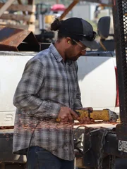 Joel cutting trailer with grinder.