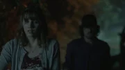 Girl crying being followed by a man with a cap.