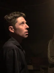 Mike Beck, walking through the basement of the Toboggan Inn.