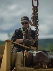 Kevin attaching chains to pump.