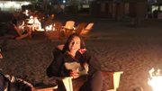 Veronica laughing by the fire