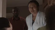 A woman and a man looks stunned at children in the doorway.