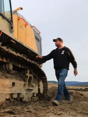 Rick approaching excavator.