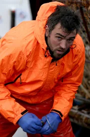 Cape Caution deckhand Zack Larson working on deck.