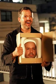 David Blaine holds up the finished mask of his face.
