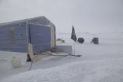 Exterior of the Wild Ranger Ice Station and the X flag that Shawn Pomrenke placed to mark a sweet spot on the claim.