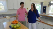 Buyers Andy Tucker and Johanna Tucker admire how bright this kitchen is at Atlantic Manor in Kitty Hawk, NC, as seen on HGTV's Beachfront Bargain Hunt.