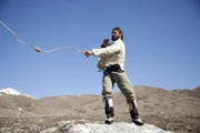 Mustang, Nepal: Hazen practicing using a slingshot.