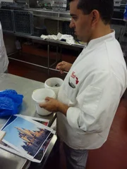 Buddy works on the birthday cake for his daughter Sofia.