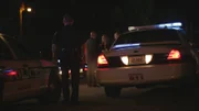 Demery talks with women at the crime scene.