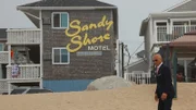 Host Anthony Melchiorri stnads on the beach in front of the Sandy Shore Motel in Westerly, RI