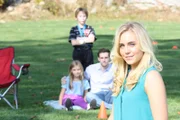 The day after writing herself a fat check for a quarter of a million bucks, Nanette Johnston and her lover, Eric Naproski go to cheer on her son at his ball game.